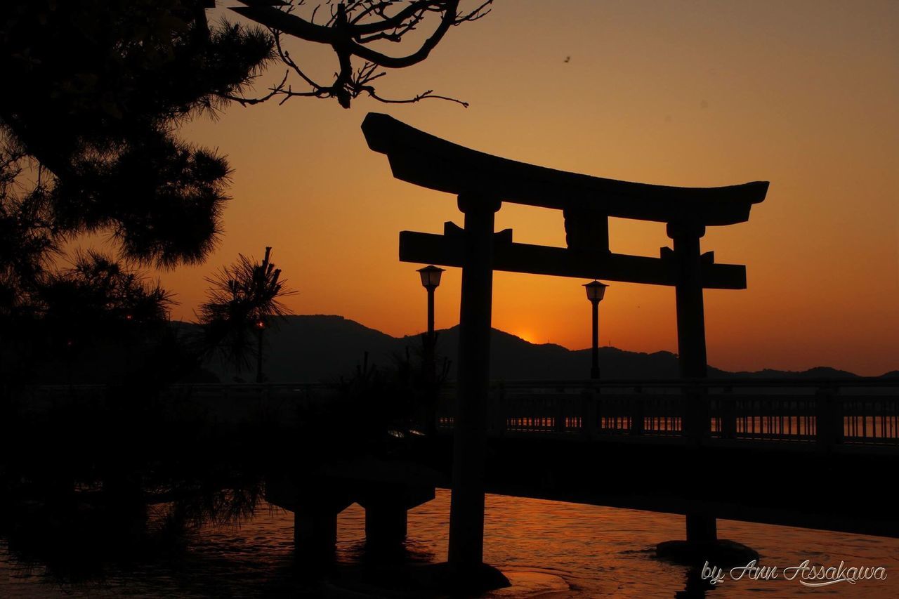 sunset, built structure, architecture, silhouette, water, tree, orange color, religion, place of worship, temple - building, spirituality, building exterior, sky, gazebo, dusk, river, tranquility, nature, travel destinations