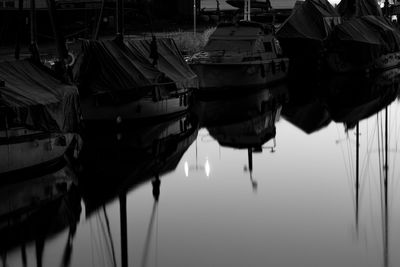 Close-up of sailboats moored in lake
