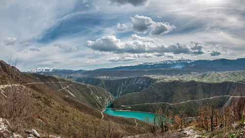 Scenic view of landscape against cloudy sky