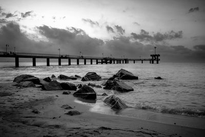 Pier over sea against sky