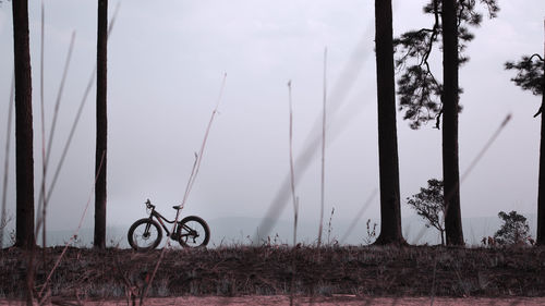 Bicycle on field against sky