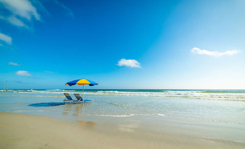 Scenic view of beach against sky