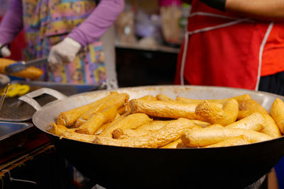 Midsection of man preparing food