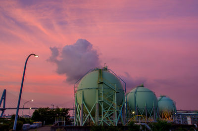Low angle view of cityscape against sky during sunset
