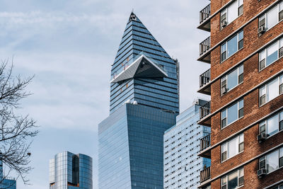 Low angle view of modern buildings against sky