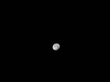 Scenic view of moon against clear sky at night