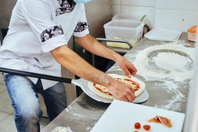 High angle view of man preparing food