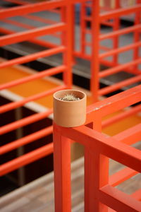 Close-up of flower pot on railing
