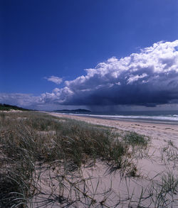 Scenic view of sea against cloudy sky
