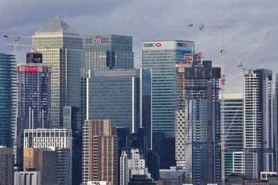 Modern buildings in city against sky