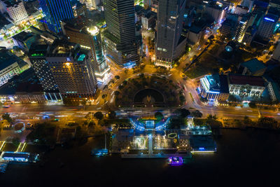 High angle view of illuminated city buildings at night