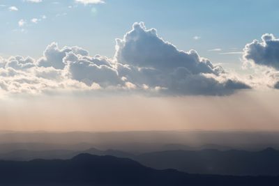 Scenic view of silhouette mountains against sky during sunset