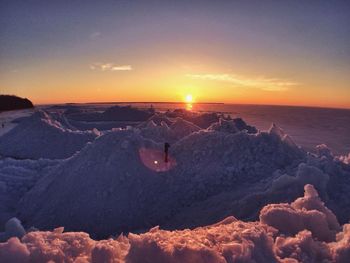 Scenic view of landscape against sky during sunset