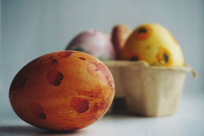 Close-up of painted eggs over white background