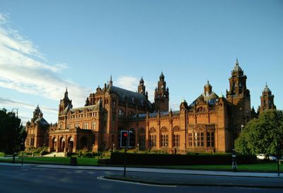 Facade of building against cloudy sky