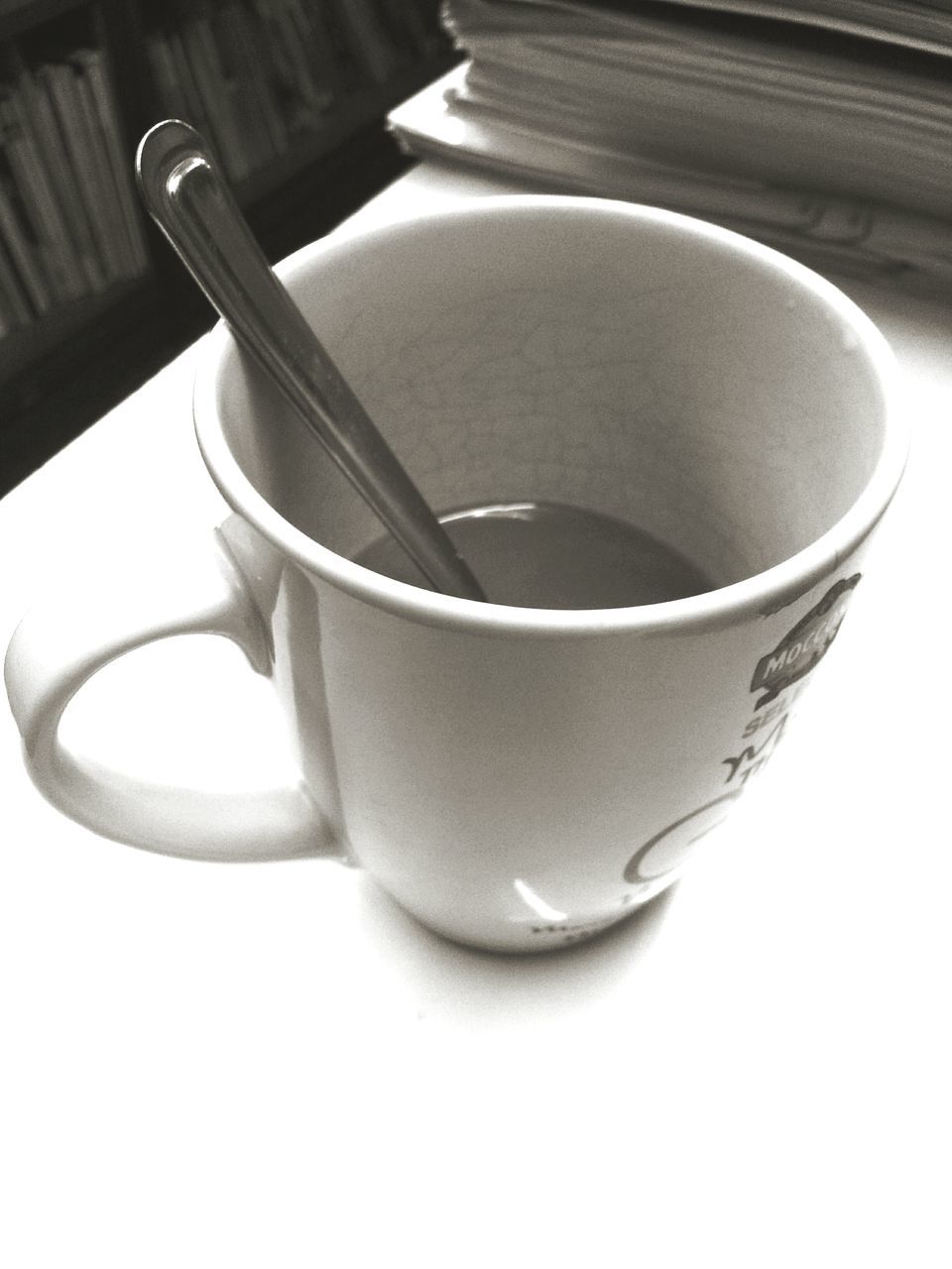 still life, indoors, close-up, table, single object, high angle view, studio shot, drink, no people, two objects, food and drink, freshness, cup, refreshment, directly above, empty, pattern, shadow, coffee cup, white background