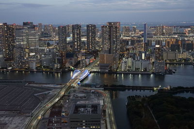 High angle view of river amidst buildings in city