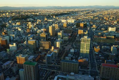 High angle view of modern buildings in city against sky