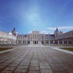 Low angle view of historical building against blue sky