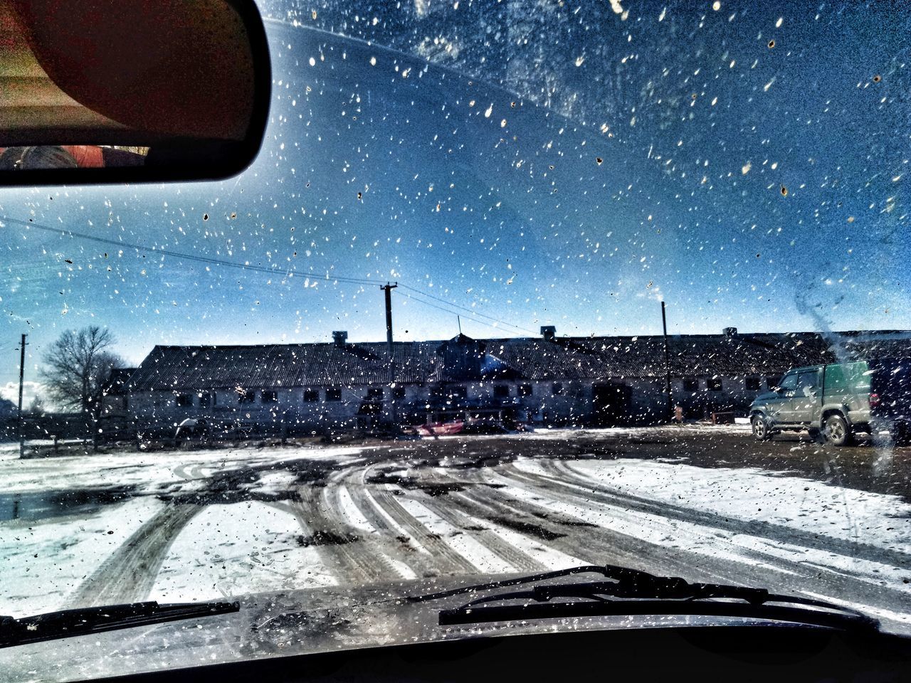 ROAD SEEN THROUGH CAR WINDOW