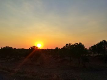 Scenic view of landscape at sunset