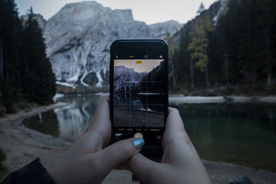 Man photographing through smart phone