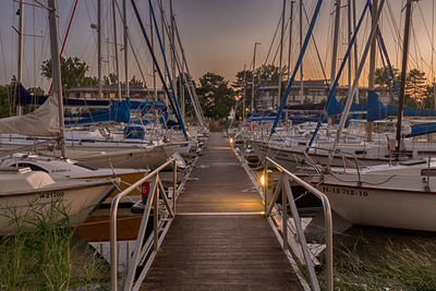 Boats moored at harbor