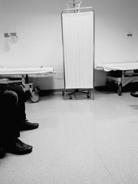 Low section of people sitting on table