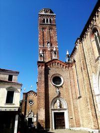 Low angle view of tower against clear blue sky