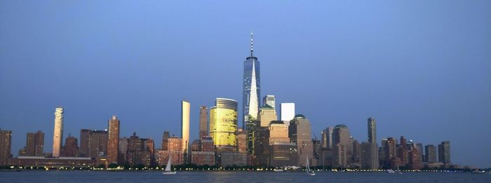 Modern buildings in city against clear sky