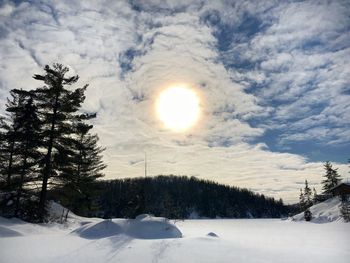 Scenic view of snow covered landscape against sky