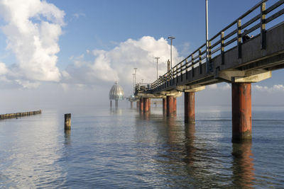 Pier over sea against sky