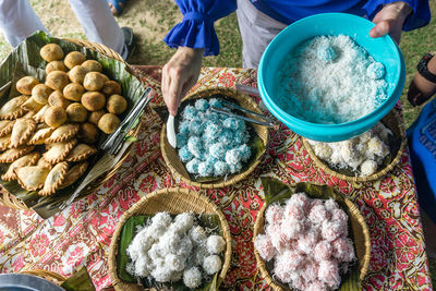 Midsection of person preparing food at table