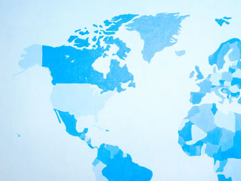 Close-up of blue paint over white background