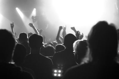 Group of people watching stage show