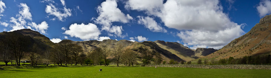 Panoramic view of golf course against sky