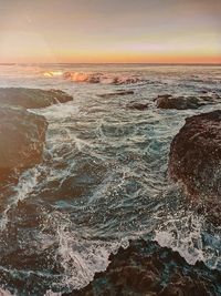 Scenic view of sea against sky during sunset