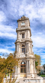 Low angle view of clock tower against sky