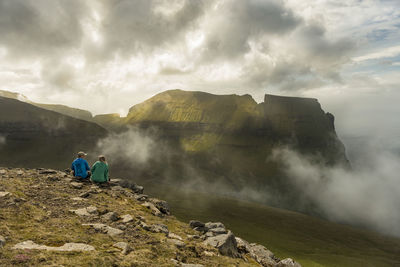 Hikers looking at view