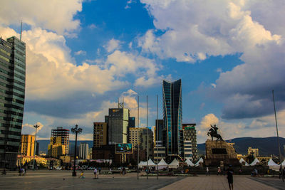 Modern buildings in city against sky