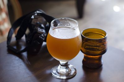 Close-up of beer glass on table