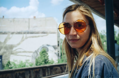 Portrait of young woman in sunglasses