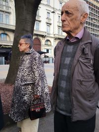 Portrait of a man standing in front of railing