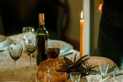 High angle view of food and wineglasses arranged on table 