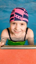 Portrait of boy swimming in pool