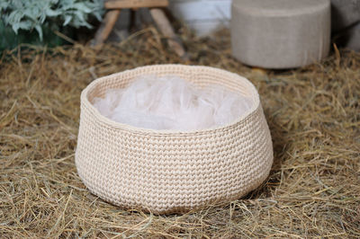 High angle view of wicker basket on grass