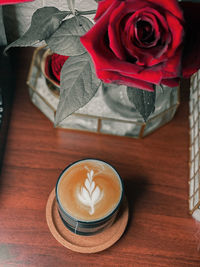 High angle view of rose on table