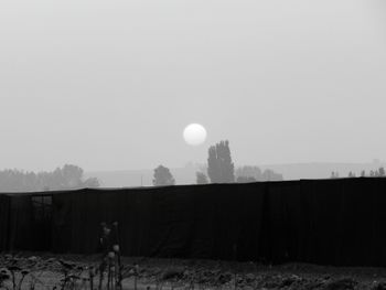 Silhouette of woman against clear sky