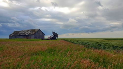 House on field against sky