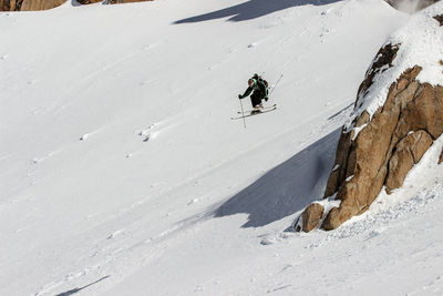 High angle view of man skiing on snowcapped mountain